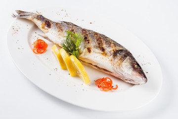 Sea food. Sea bass baked on the grill (close)