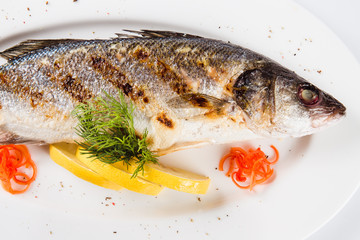 Sea food. Sea bass baked on the grill (top view close)