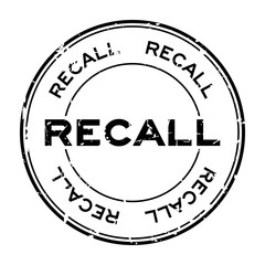 Grunge black recall round rubber seal stamp on white background