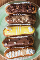 Eclairs with different ganache and icing with different toppings
