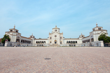 Naklejka premium Monumental Cemetery in Milano, Italy, also known as Cimitero Monumentale di Milano - one of the largest cemeteries and main landmarks in the city. Famedio chapel is main entrance to graveyard.