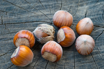 close-up of hazelnuts on a old wooden surface