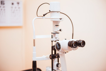 Fototapeta na wymiar Slit lamp. Biomicroscope. Binoculars. Ophthalmic equipment.. Close up, selective focus. Health care concept. Space for text