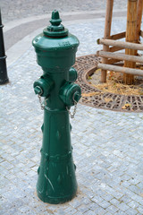 Obraz na płótnie Canvas Fire hydrant in the middle of the street. Faucet in the of the stree.
