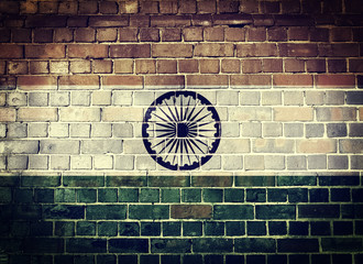 Grunge India flag on a brick wall
