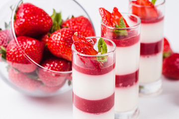 Strawberry Panna Cotta on a white background (close)