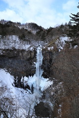 Fototapeta na wymiar Kegon-no-taki Waterfall of Nikko City in Winter / Kegon waterfall is the most famous of Nikko's many beautiful waterfalls.