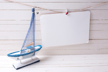 Fototapeta premium Decorative wooden toy sailing boat and empty tag