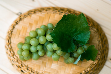 Grapes of grapes on a wooden table.