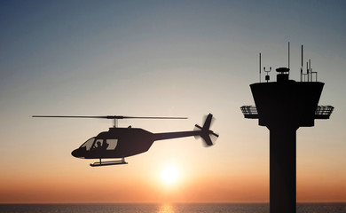 Fototapeta na wymiar helicopter on the sunset