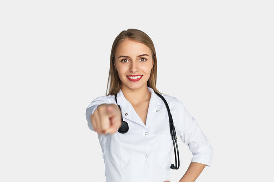 Female Doctor Pointing At Camera