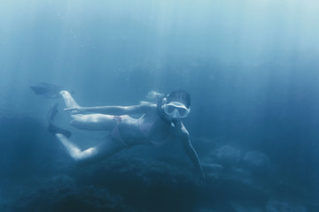 Girl free diving.