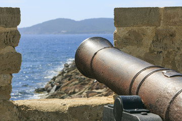 Fototapeta na wymiar Old war iron canon in Sardinia