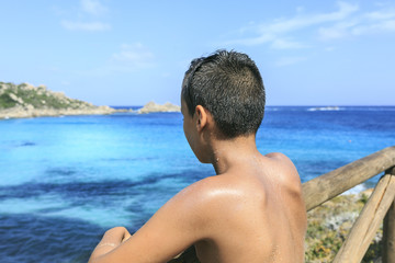 Boy seeing the blue sea