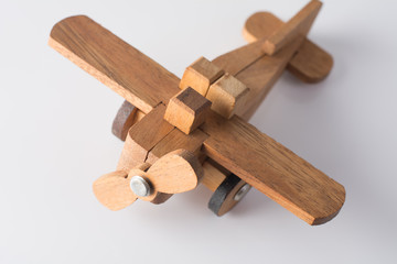 Wooden plane on white background.