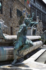 Fototapeta na wymiar Statue on the Fountain of Neptune on the Piazza della Signoria in Florence