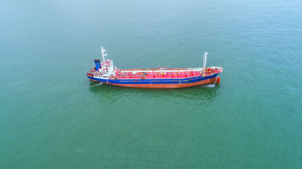 Naklejka premium oil tanker, gas tanker in the high sea.Refinery Industry cargo ship. top view,aerial view,Thailand, in import export, LPG,oil refinery, Logistics and transportation with working crane bridge in harbor