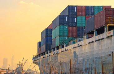 container ship in import export and business logistic.By crane ,Trade Port , Shipping.cargo to...