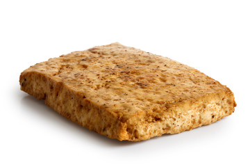 Single block of marinated tofu isolated on white.