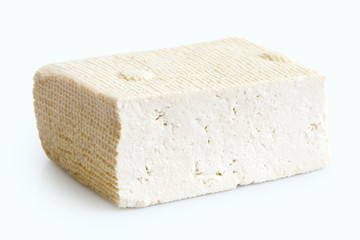 Single block of white tofu isolated on white.