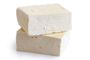 Two blocks of white tofu isolated on white. - obrazy, fototapety, plakaty
