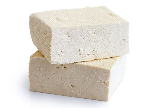 Two blocks of white tofu isolated on white.