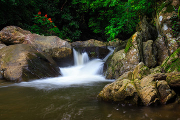 Naklejka na ściany i meble Palau waterfall in Thailand