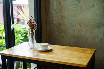 matcha latte on a wooden background in coffee shop