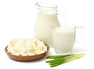 Glass jug pitcher of fresh milk with glass and cottage cheese isolated on white background carafe