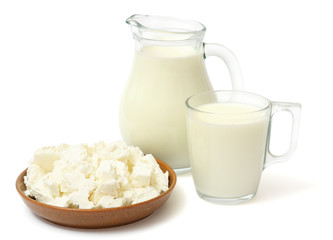 Glass jug pitcher of fresh milk with glass and cottage cheese isolated on white background carafe