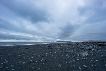 Iceland - Black stony sand beach of Vik in the evening