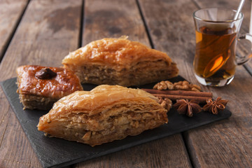Turkish sweets baklava with tea nuts and cinnamon