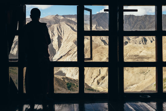 Lingshed monk looking through the window
