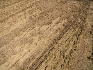 
aerial view of a wheat field broken by the last rain with a thunderstorm. Destruction of cereal...