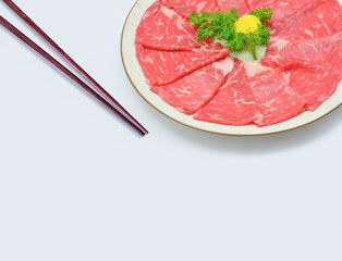 Fresh beef, wagyu and chopsticks on white background, copy space