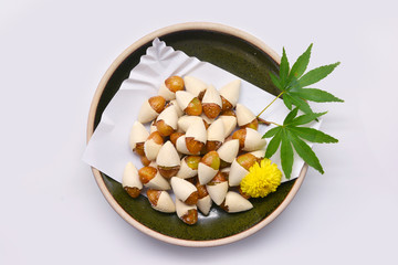 Bake Ginkgo (Ginkgo biloba) salt in brown bowl Japanese style on white background