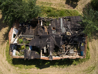 Fototapeta premium Aerial view of an old abandoned and destroyed farmhouse in germany