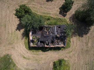 Aerial view of an old abandoned and destroyed farmhouse in germany