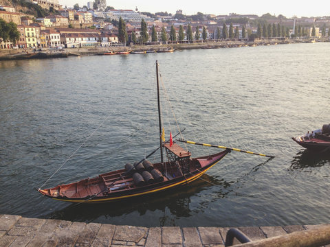 Typical rabelo boat and Porto historical district in background, Portugal