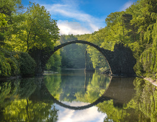 Fototapeta na wymiar Bridge in rhododendron park in Kromlau, Germany
