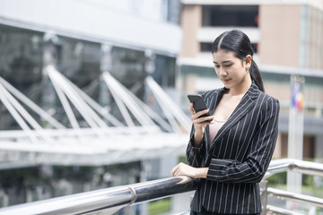 Fototapeta premium Business people looking to smartphone. People wolking for business project. Business people working concept.