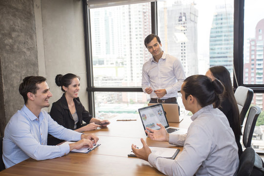 Businessman standind for present the project with team, Portrait business leader concept, 20-30 year old.
