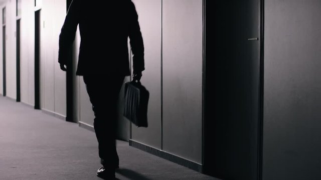 Office employee walking down corridor
