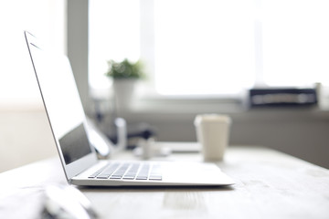 Designer's desk with a cup of fragrant coffee