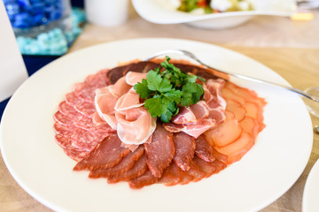 A dish of sausage and meat.