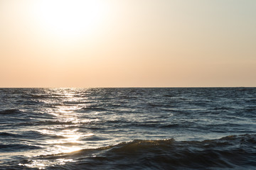 Sea waves at sunset. Beautiful background.
