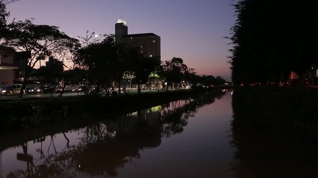 River in city with sunset