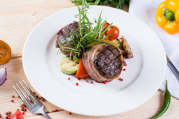  Beef steak on a wooden background