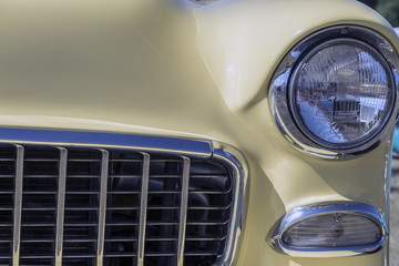 Headlights on a yellow car