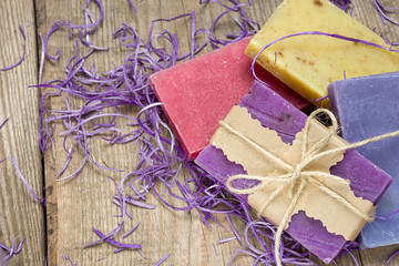 Collection of handmade, natural organic soap on wooden background. Spa products.